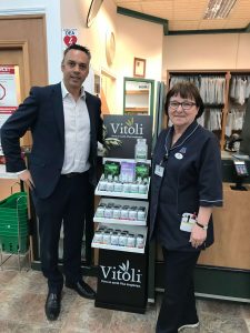Dr Eric Simard in a Jean Coutu to promote Vitoli with a pharmacist